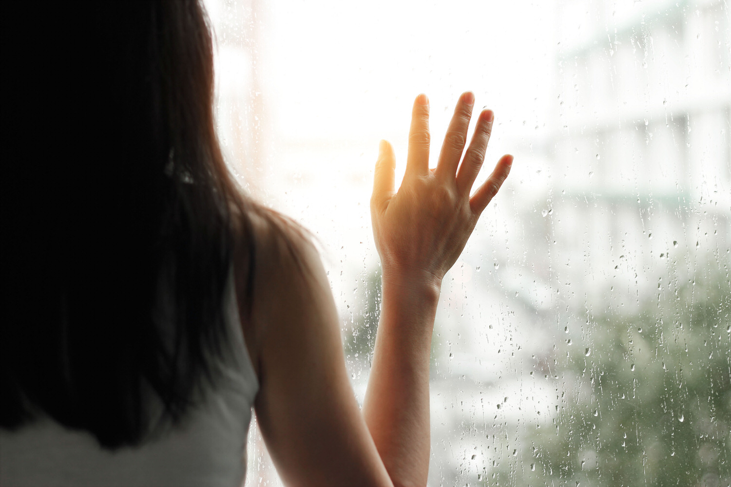 Woman looking out window