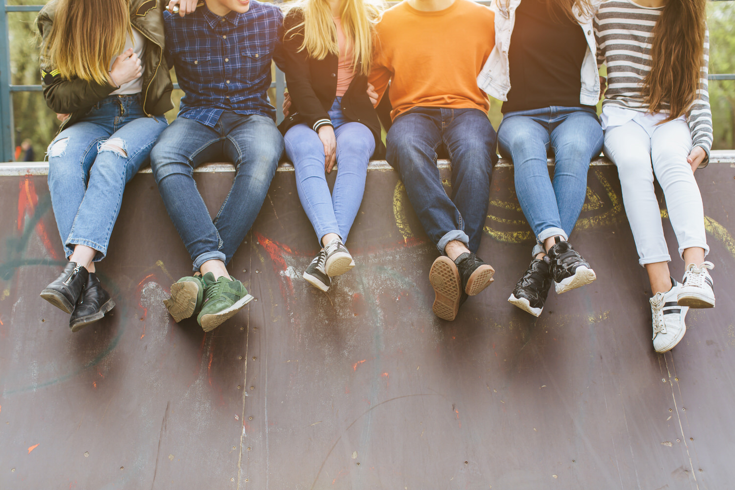 Youth sitting on wall