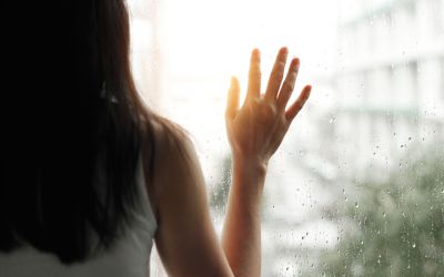 Woman looking out window